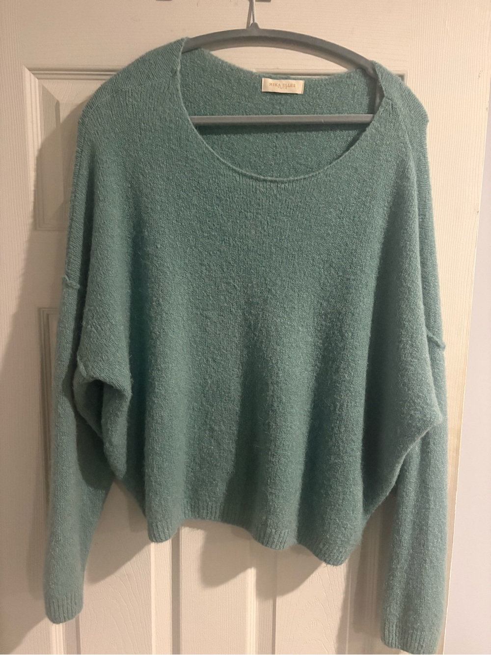 Seafoam Green oversized sweater with wide open neck.